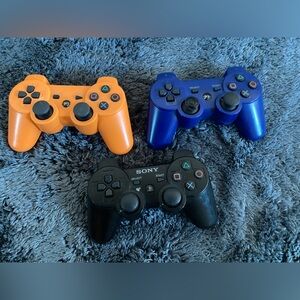 Sony Wireless Controllers - Black, Blue, and Orange - PlayStation 3
